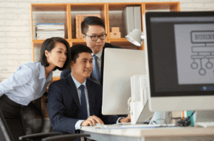 cybersecurity malaysia team grouped up looking at the monitor