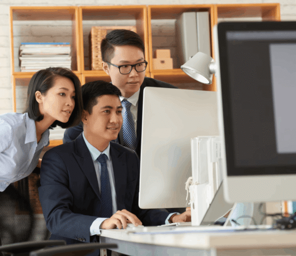 cybersecurity malaysia team grouped up looking at the monitor